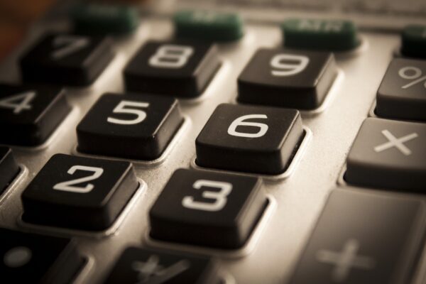 A calculator is useful to set all costs, which is one of the financial planning tips for international relocations. 
