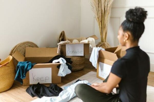 A woman with packing boxes streamlining your belongings for an international move